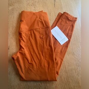 Athleta Salutation Stash Tight M